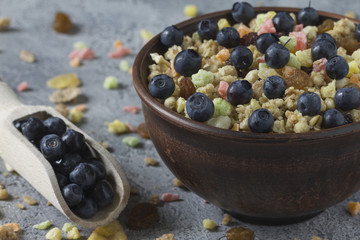 Wall Mural - Muesli with dried fruits in a ceramic plate for breakfast. Healthy Breakfast.