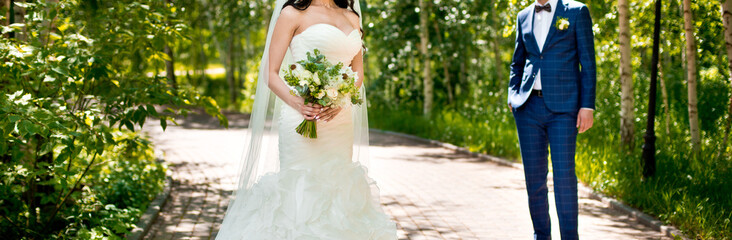 Wall Mural - Beautiful wedding bouquet of flowers in hands of the bride