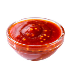 Red hot sauce from chilli peppers and tomatoes in small glass bo