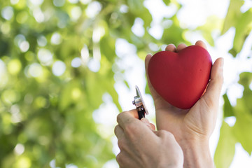 Heart in hands doctor on green background healt hcare service