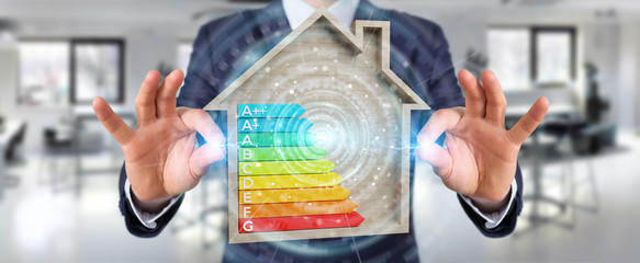 Wall Mural - businessman using 3d rendering energy rating chart in a wooden house