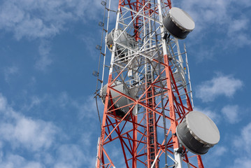 Telecommunication tower with antennas with blue sky. closeup telecommunications tower.