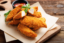 Delicious Crispy Fried Breaded Chicken Breast Strips With Ketchup.