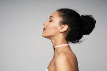 Beauty Closeup Profile Portrait Of Beautiful Mixed Race Caucasian - African American Woman Wearing Chocker With Closed Eyes, Isolated On Gray Background