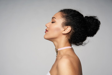 beauty closeup profile portrait of beautiful mixed race caucasian - african american woman wearing c