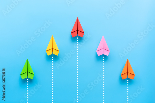 Cuadros en Lienzo Paper plane on blue background, Business competition concept.