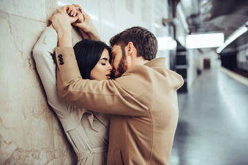 Young romantic couple in subway