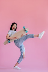 Wall Mural - Young girl on pink background