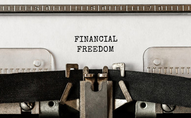 Fototapete - Text Financial Freedom typed on retro typewriter