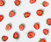 Halves Of Strawberries On The White Background.