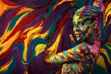 portrait of the bright beautiful woman with art colorful make-up and bodyart