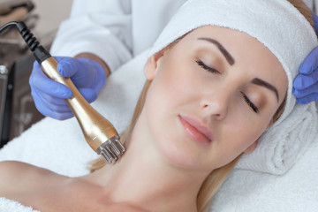 Portrait of woman getting rf-lifting. Rf lifting procedure in a beauty parlour