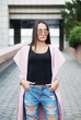 © asashka - Young brunette wearing coat and sunglasses
