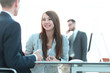 © ASDF - business woman shaking hands with a business partner.