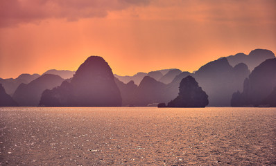 Halong bay boats,Sunset at Ha Long Bay scenic view , Hanoi, Vietnam , Southeast Asia