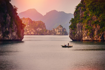 Wall Mural - Halong bay boats,Sunset at Ha Long Bay scenic view , Hanoi, Vietnam