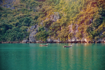 Halong bay boats,Sunset at Ha Long Bay scenic view , Hanoi, Vietnam