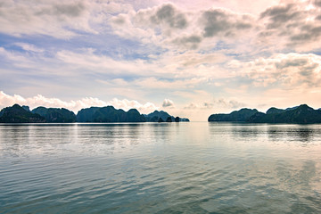 Wall Mural - Halong bay boats, Vietnam Panoramic view of sunset in Halong Bay, Vietnam, Southeast Asia,UNESCO World Heritage Site