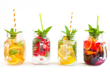 Homemade Iced Lemonade With Mint, Summer Fruits And Berries In A Mason Jar. Copy Space Background