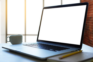 Fototapete - Laptop with blank screen on table. Workspace background new project on laptop computer with blank copy space screen for your advertising text message