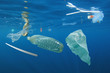 © Richard Carey - Plastic ocean pollution. Underwater bags, bottles, cups, straws