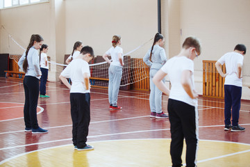 Wall Mural - Primary school children a sport lesson indoors