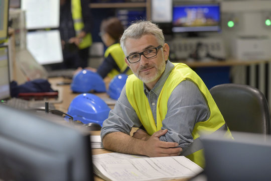 Industrial technician in control room