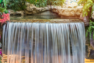 landscape of beautiful Waterfall in garden at public park