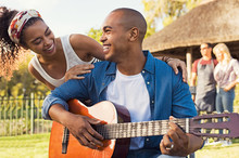 Happy Man Playing Guitar Outdoor