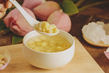 Vietnamese food, sweet lotus seed gruel, ingredients: lotus bean, sugar candy. this Vietnam dish for dessert or snack, very delicious, tasty, nutrition, make sleep well