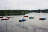 Fototapeta Pomosty - Colorful boats on the lake