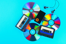 The Concept Of The Evolution Of Music. Cassette, CD-disk, Mp3 Player. Vintage And Modernity. Music Support.