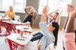 © LIGHTFIELD STUDIOS - group of happy young students clapping in classroom