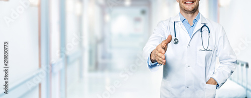 Cuadros en Lienzo happy friendly doctor standing in hospital hallway
