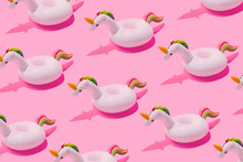 Inflatable Unicorn Pool Toy Pattern On Pastel Pink Background. Minimal Summer Concept.