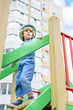 © LIGHTFIELD STUDIOS - low angle view of little boy in panama going downstairs at playground