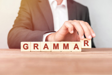 Poster - man made word grammar with wood blocks