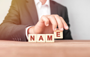 Poster - Man made word NAME with wood blocks