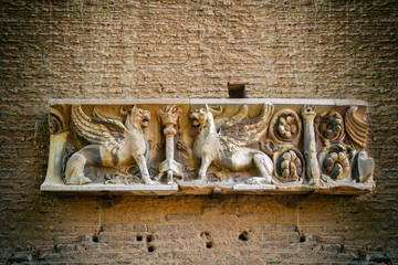 Wall Mural - Ancient Roman brickwork with sign. Bricks, Roman concrete, Rome. Background