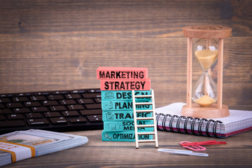 Wall Mural - Marketing Strategy Business Concept With Colorful Wooden Blocks. Keywords and icons
