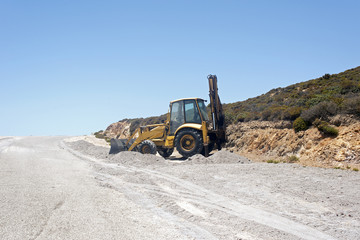 a bulldozer in the making of a road in a construction site