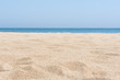 © Visual Content - sea sand and blue sea background