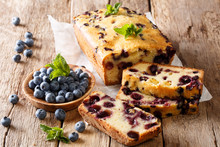 Summer Loaf Of Fresh Blueberry Muffin Bread Cake Decorated With Mint Closeup. Horizontal