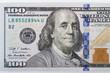 Macro shot of a 100 dollar. Dollars Closeup Concept. American Dollars Cash Money. One Hundred Dollar Banknotes. Hundred Bucks. Benjamin Franklin's portrait.