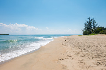 HDR shot of sea shore with wave and white sand during summer day in thailand (selective focus and white balance / color tone shift )