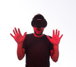 © kegfire - Shocked man in VR goggles with hands up