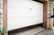 Garage door PVC. Hand use remote controller for closing and opening garage door