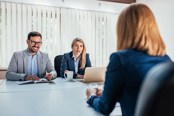 Wall Mural - Business - young woman sitting in job interview.