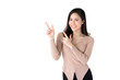 Beautiful young Asian woman pointing hands to empty space aside