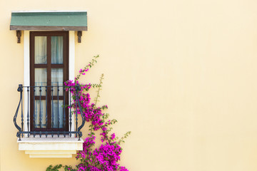 Wall Mural - A window with a balcony on a beige wall